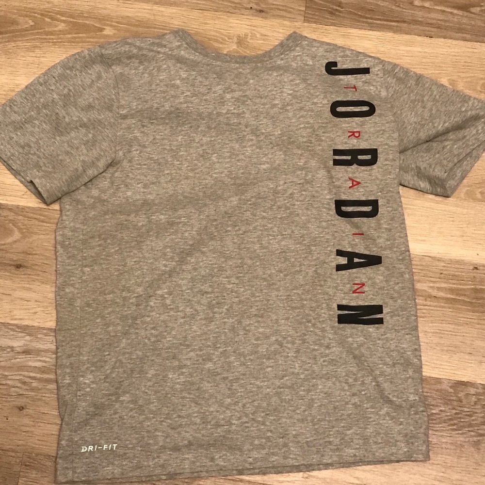 A grey Jordan t-shirt .